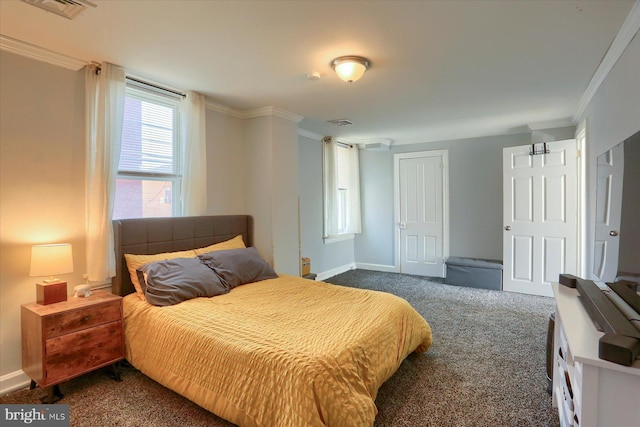 bedroom with visible vents, dark colored carpet, and ornamental molding