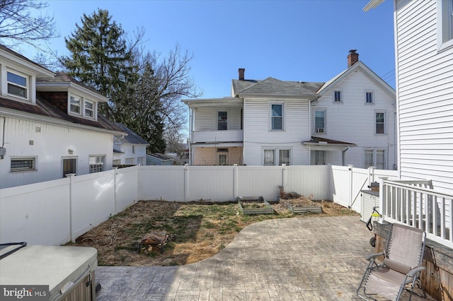 exterior space featuring a patio area and a fenced backyard