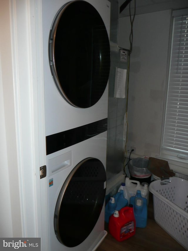 laundry room featuring stacked washer and clothes dryer