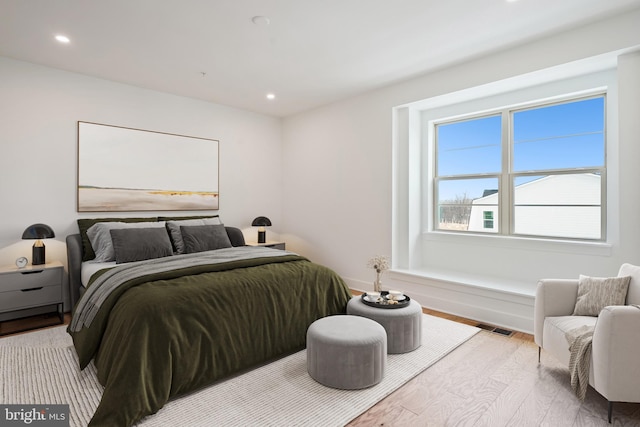 bedroom with light hardwood / wood-style floors