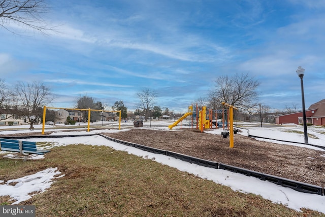 snow covered playground featuring playground community