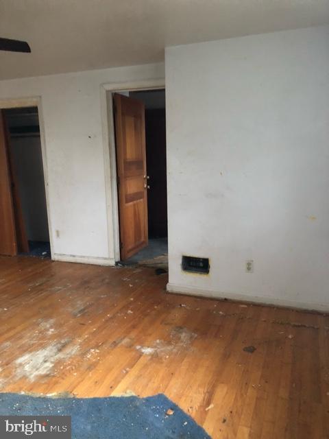 unfurnished room featuring wood-type flooring