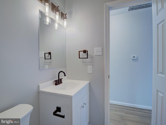 bathroom featuring wood-type flooring and vanity