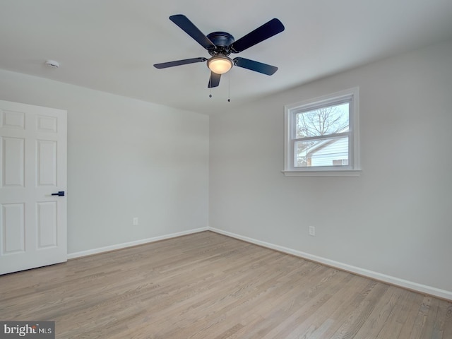 empty room featuring ceiling fan and light hardwood / wood-style floors