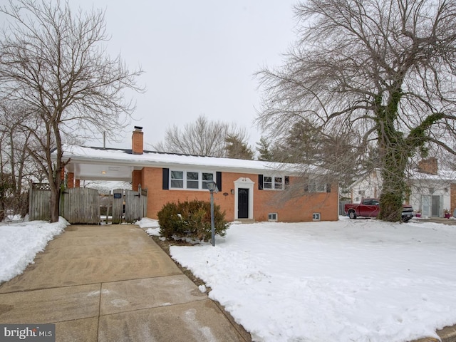 view of front of home featuring a carport