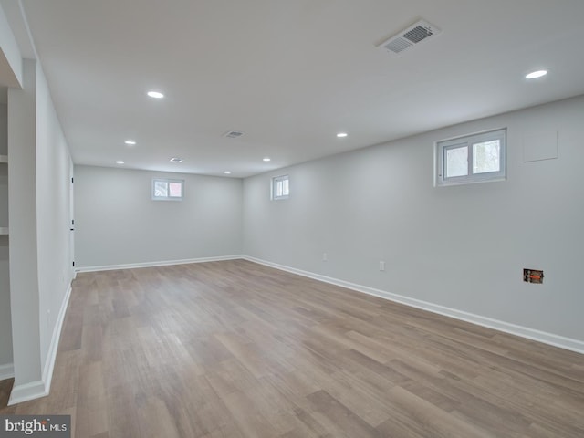 basement featuring light hardwood / wood-style flooring