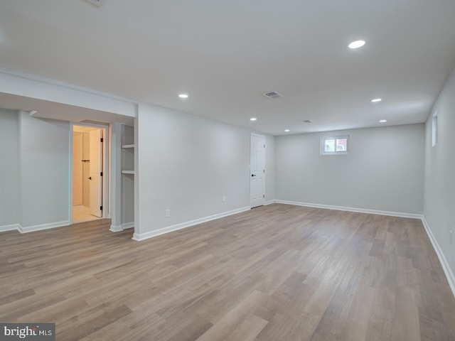 basement featuring light wood-type flooring