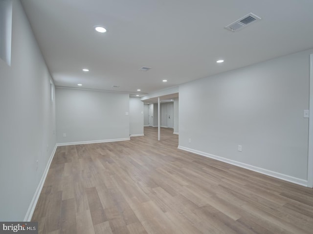 basement featuring light hardwood / wood-style flooring