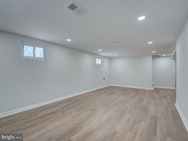 basement featuring light hardwood / wood-style floors