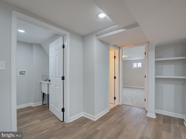 corridor featuring light hardwood / wood-style flooring