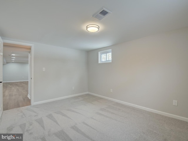 empty room featuring light carpet