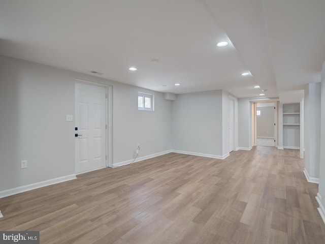 basement featuring light hardwood / wood-style flooring