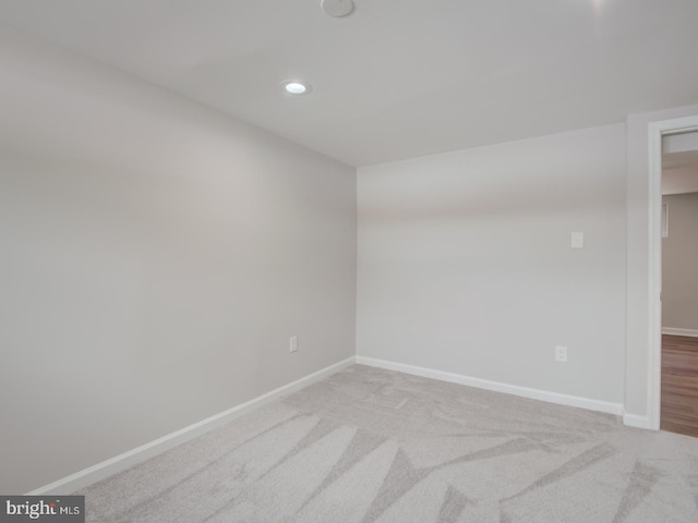 empty room featuring light colored carpet