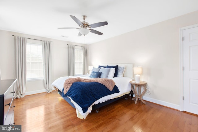 bedroom featuring ceiling fan and hardwood / wood-style floors