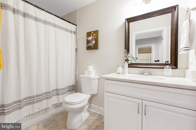 bathroom featuring vanity, toilet, and a shower with shower curtain