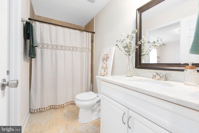 bathroom featuring vanity, toilet, and walk in shower