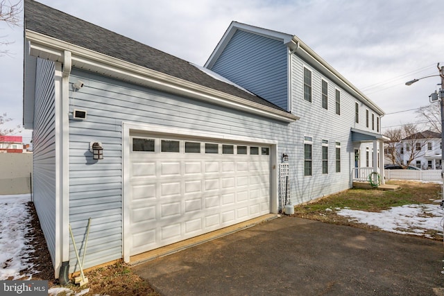 view of side of property with a garage