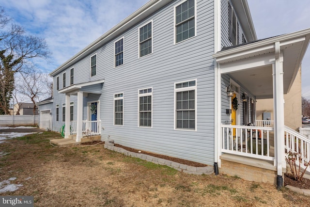 rear view of house with a yard