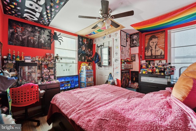 bedroom featuring ceiling fan and hardwood / wood-style floors