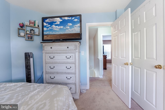 bedroom featuring light colored carpet