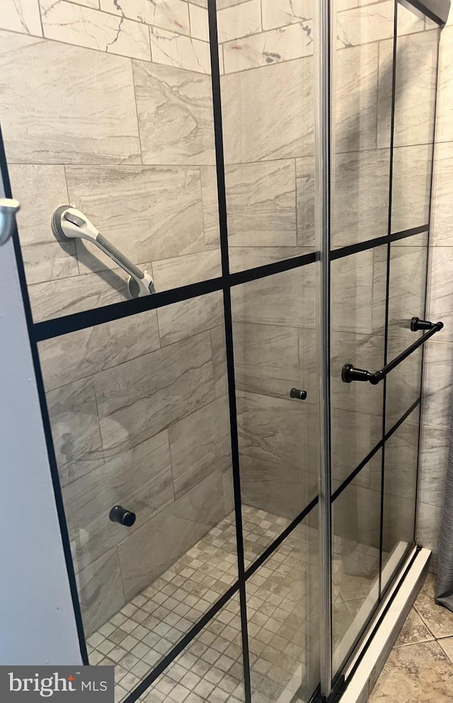 bathroom with a tile shower