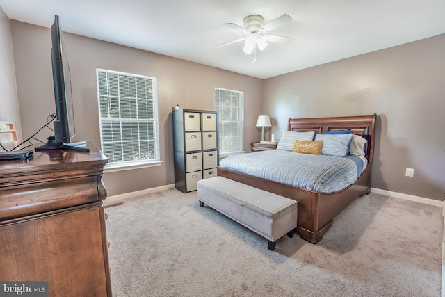 bedroom with light colored carpet and ceiling fan