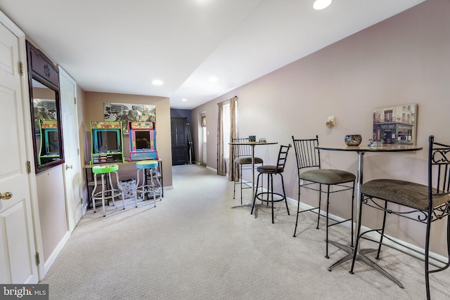 dining area with light colored carpet