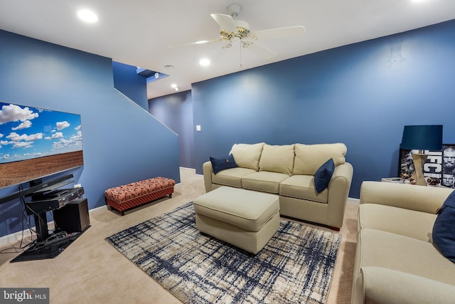 carpeted living room with ceiling fan