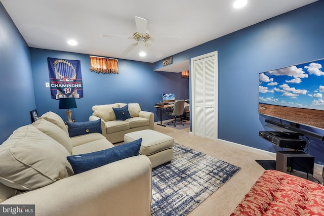 carpeted living room with ceiling fan