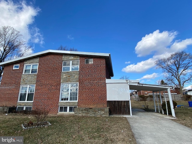 view of home's exterior with a carport