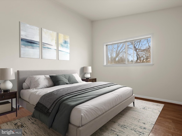 bedroom featuring dark hardwood / wood-style flooring