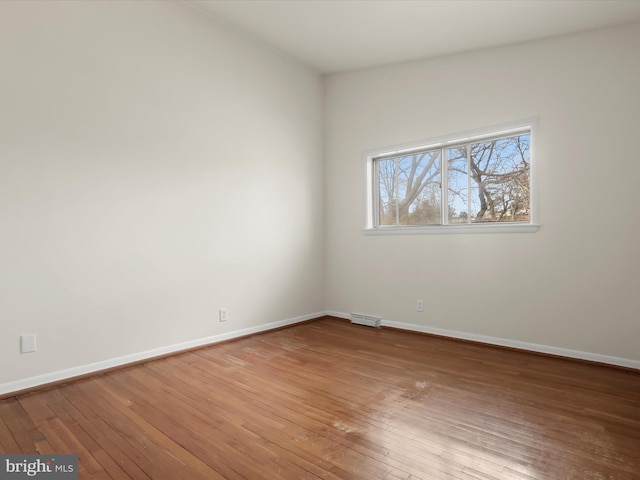 unfurnished room featuring wood-type flooring