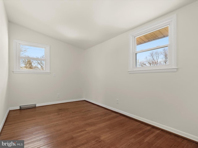 empty room featuring hardwood / wood-style flooring