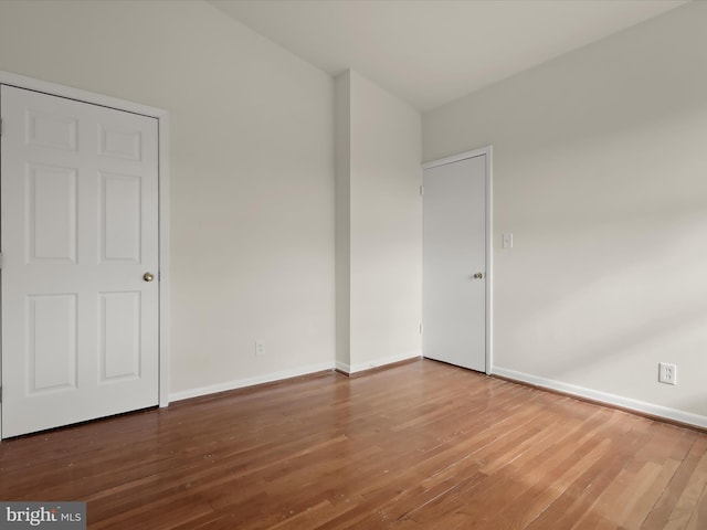 unfurnished room featuring wood-type flooring