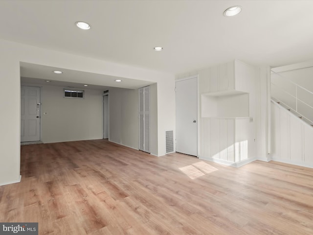 spare room featuring light hardwood / wood-style flooring