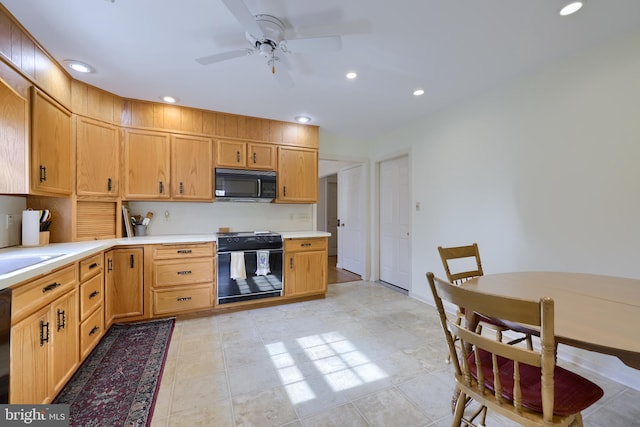 kitchen featuring black appliances, ceiling fan, light countertops, and recessed lighting