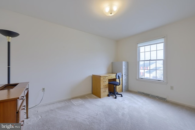 office with light carpet and visible vents