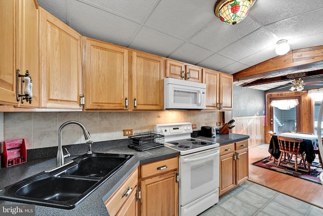 kitchen featuring ceiling fan, a drop ceiling, white appliances, and sink