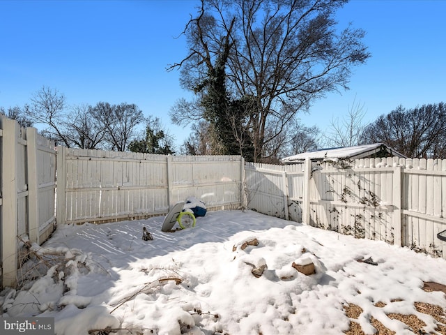 view of yard covered in snow