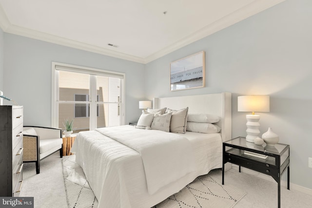 carpeted bedroom featuring crown molding