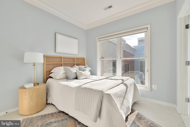 bedroom with crown molding and carpet