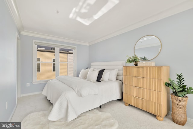 carpeted bedroom with ornamental molding