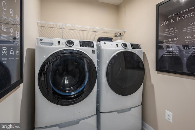 laundry room with independent washer and dryer