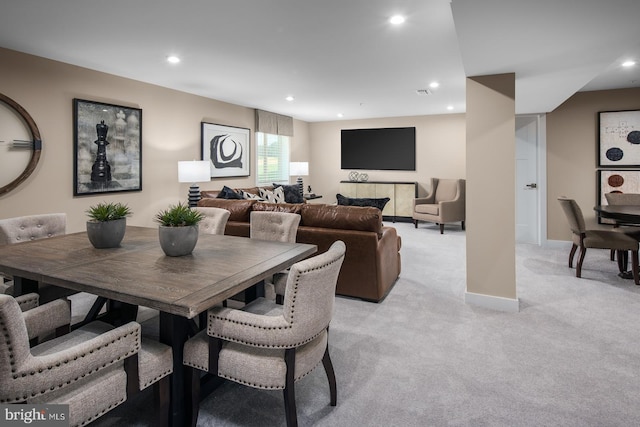 dining area with light carpet