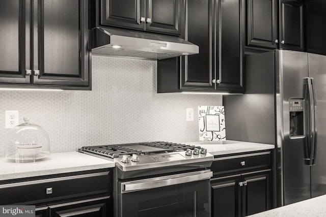 kitchen with tasteful backsplash and stainless steel appliances