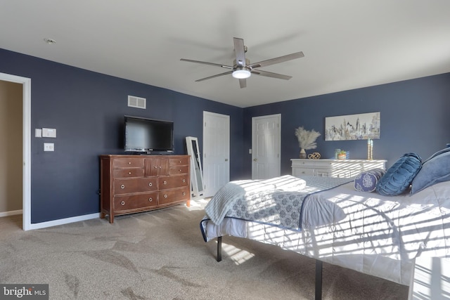 carpeted bedroom featuring ceiling fan