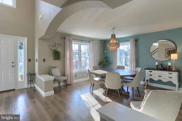 dining space featuring an inviting chandelier and wood-type flooring