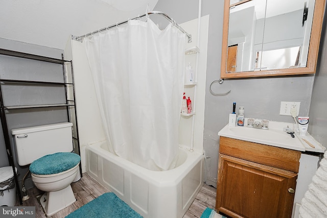 full bathroom with vanity, hardwood / wood-style flooring, toilet, and shower / bath combo with shower curtain