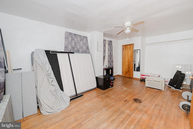 misc room featuring ceiling fan and light hardwood / wood-style floors