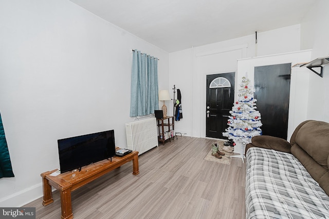 living room featuring light hardwood / wood-style flooring and radiator heating unit